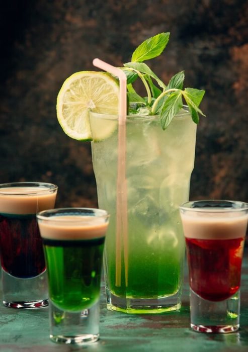 glass-mojito-with-three-colorful-shots-around_140725-10694
