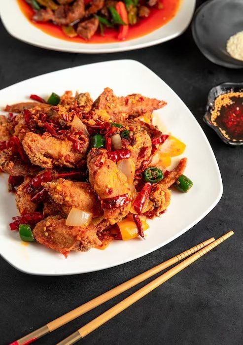 imgi_18_fried-chicken-with-red-green-chili-peppers-onion-plate_141793-1657